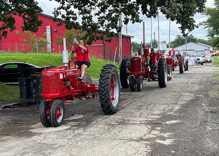 red tractors in a line for parade